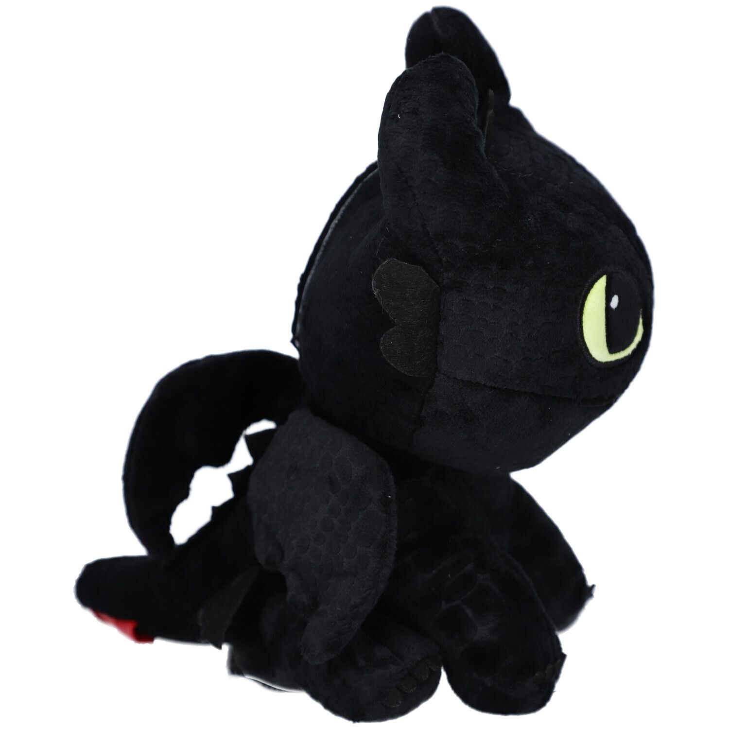 Peluche noire en forme de dragon, vue de côté. Ailes, oreilles et un accent rouge sont visibles.