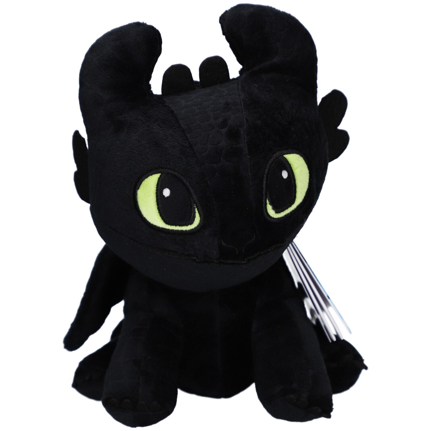 Peluche noire en forme de dragon avec des yeux jaunes. Le jouet en peluche a des oreilles et une étiquette.