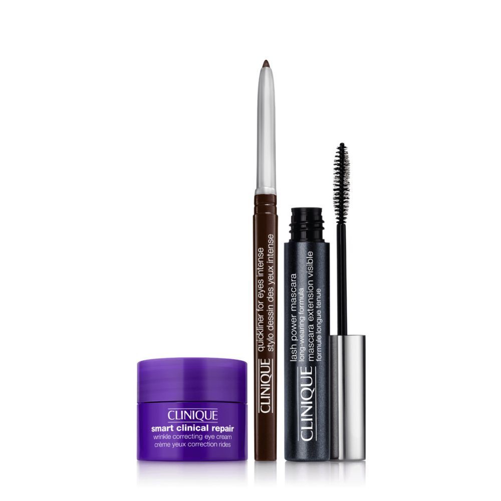 Coffret Clinique Eye Essential. Contient mascara, eyeliner et crème pour les yeux. Emballage violet avec noms et étoiles.