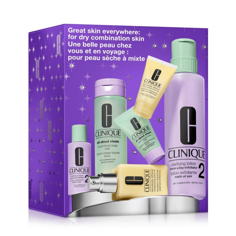 Coffret Clinique pour peaux mixtes à sèches. Plusieurs produits dans une boîte violette. Contient des flacons, des tubes et une pompe.