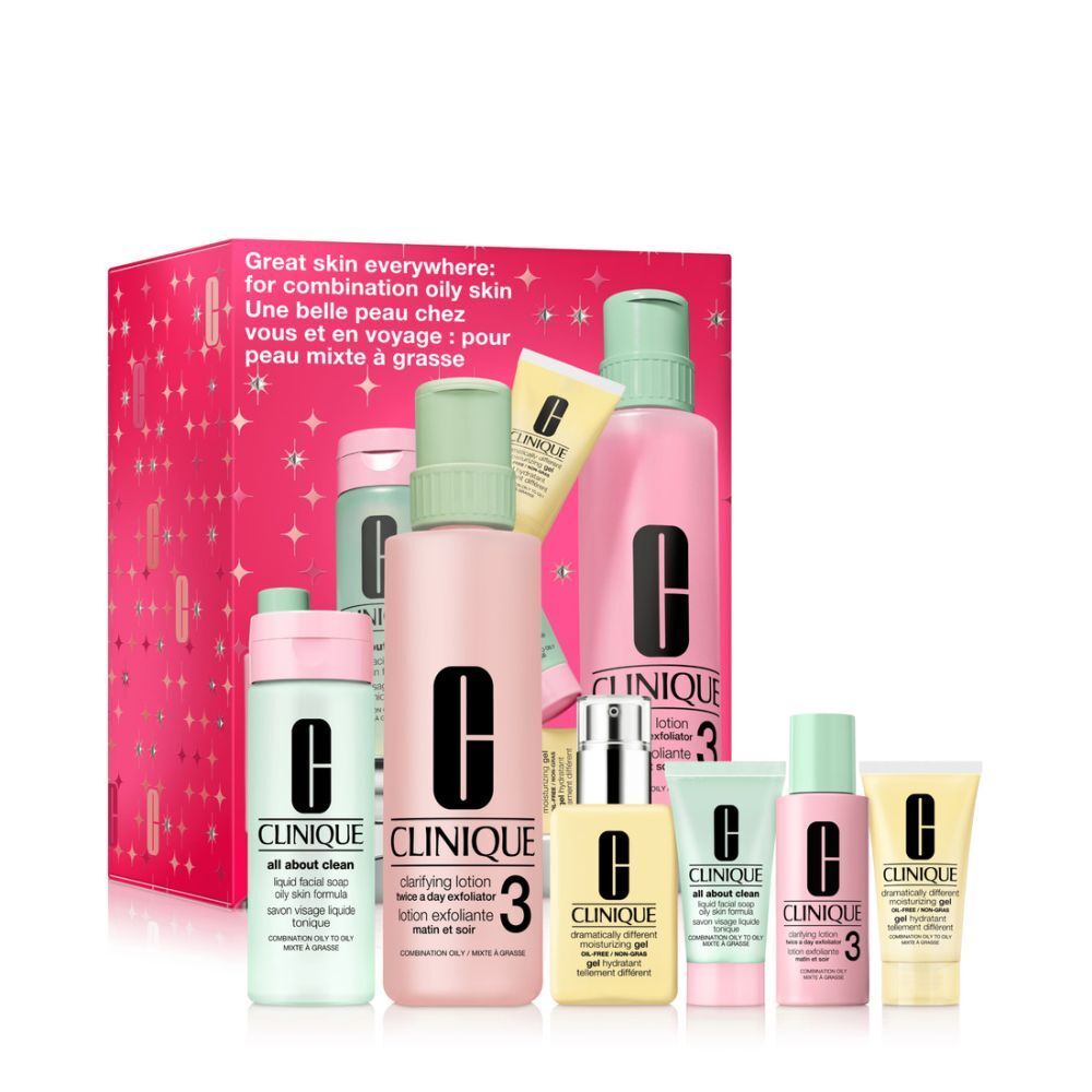 Coffret de soins pour la peau. Emballage rose à motifs étoiles. Contient des flacons, tubes et pots avec le logo Clinique.