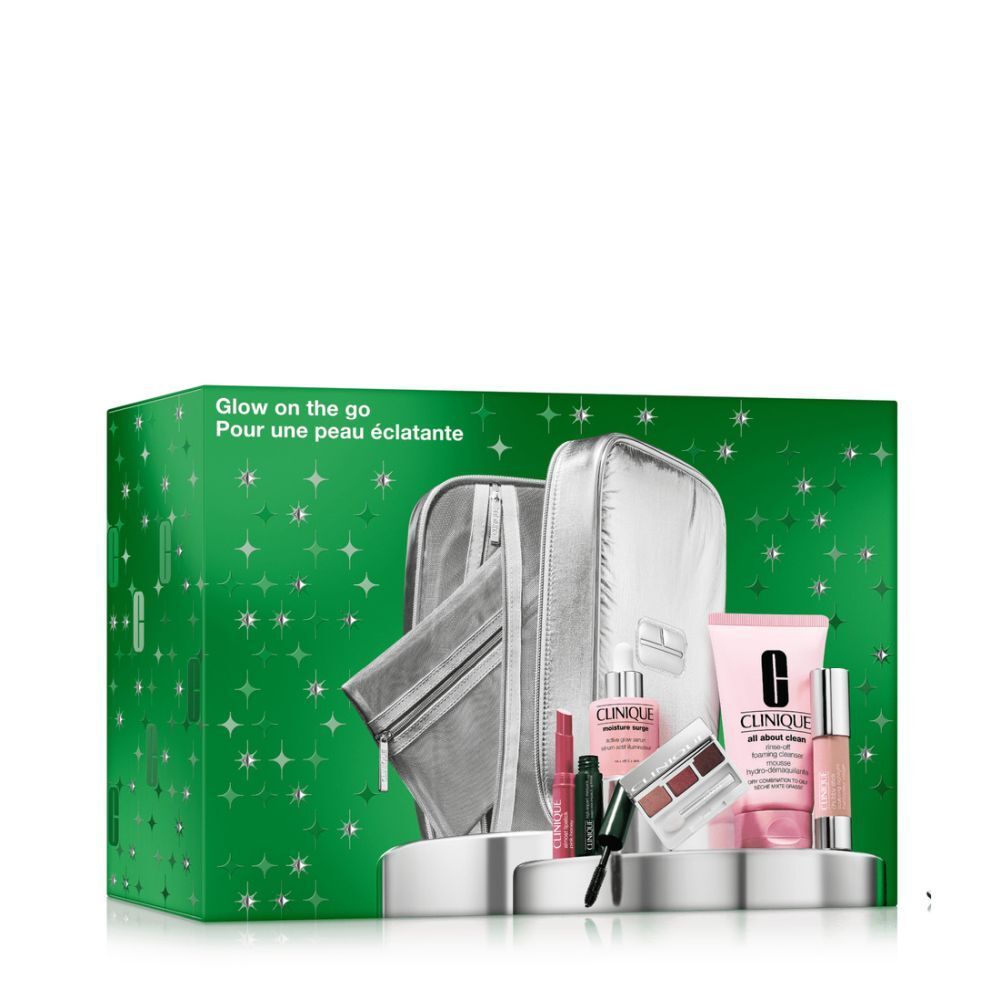 Trousse de maquillage argentée avec produits cosmétiques. Contient sérum, nettoyant moussant, mascara, fard à paupières, rouge à lèvres.