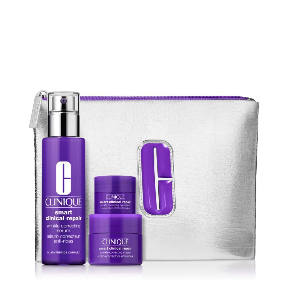 Coffret cosmétique avec flacon violet, pots et trousse argentée. Texte: Clinique, Smart Clinical Repair.