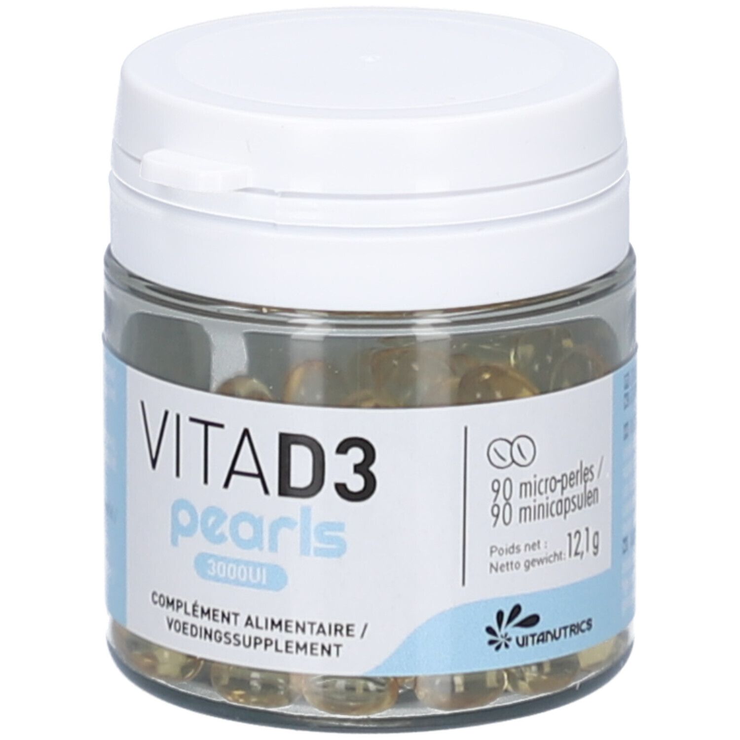 Flacon en verre avec couvercle blanc. Contient des perles jaunâtres. Étiquette avec texte: VITA D3 pearls 3000UI. Complément alimentaire. Logo Vitanutrics.