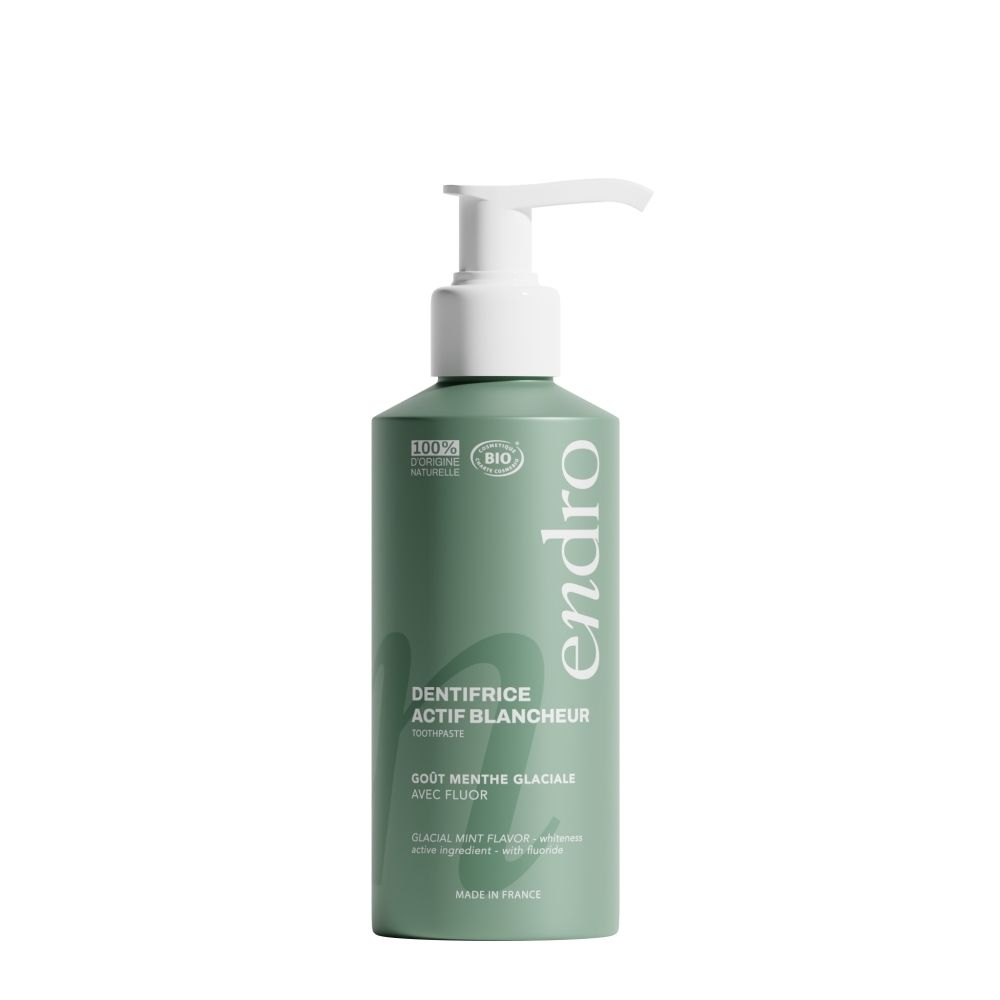 Tube vert avec distributeur, dentifrice Endro, "actif blancheur", "goût menthe glaciale".