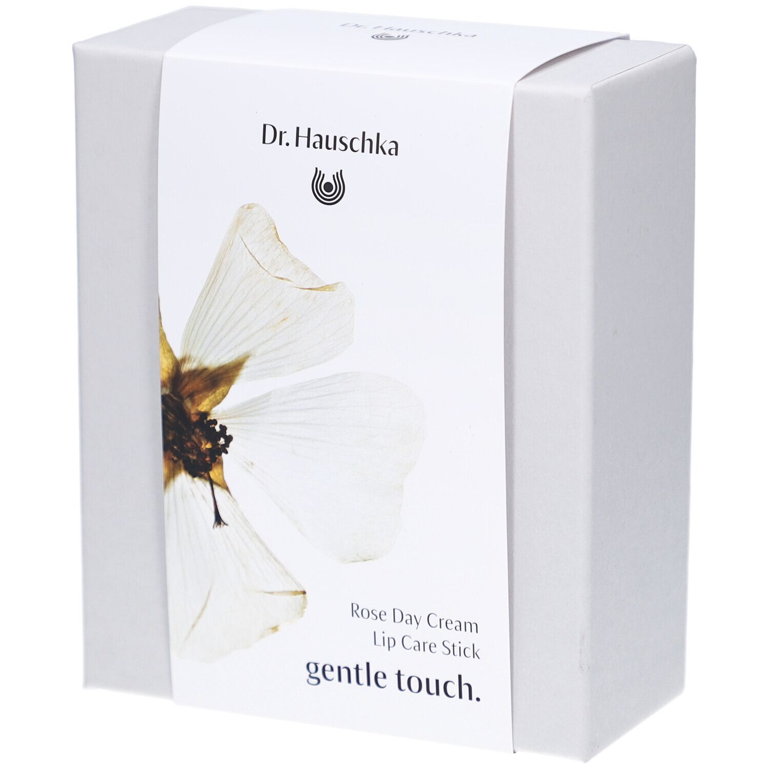 Boîte blanche avec étiquette. Inscription: Dr. Hauschka, Rose Day Cream, Lip Care Stick, gentle touch.