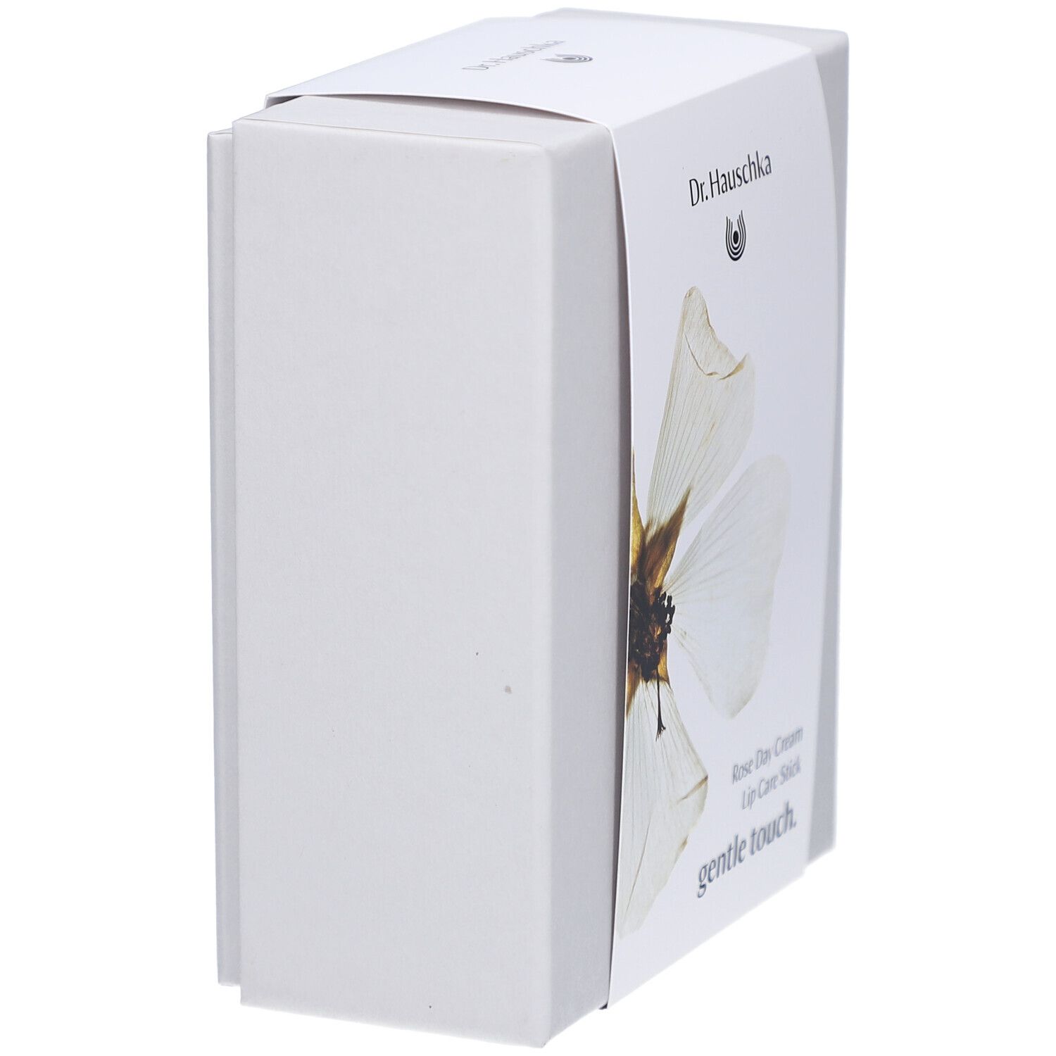 Boîte blanche, vue latérale. Étiquette avec: Dr. Hauschka, Rose Day Cream, Lip Care Stick.
