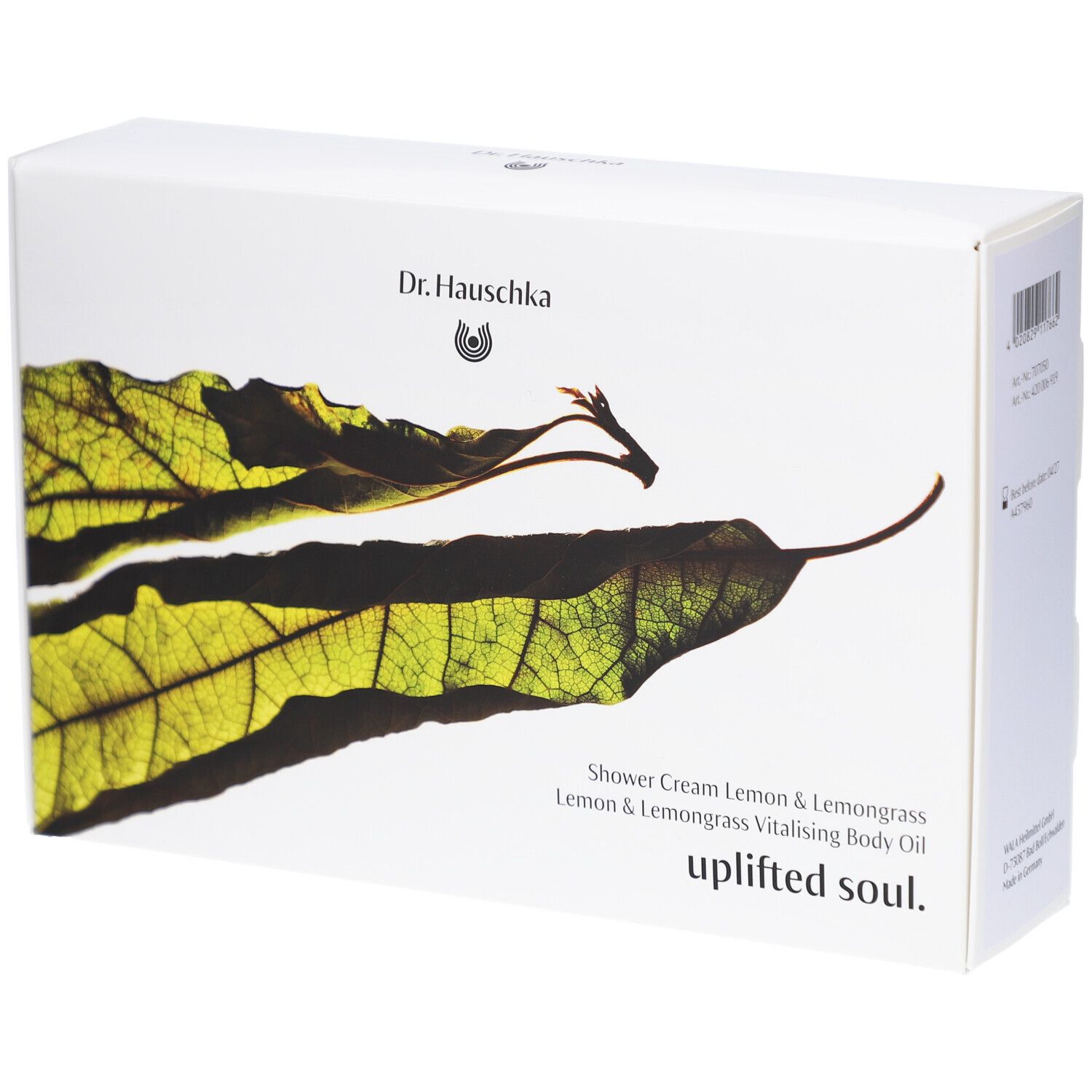 Boîte blanche avec motif de feuille et texte. Contient: Shower Cream Lemon & Lemongrass, Uplifted Soul.