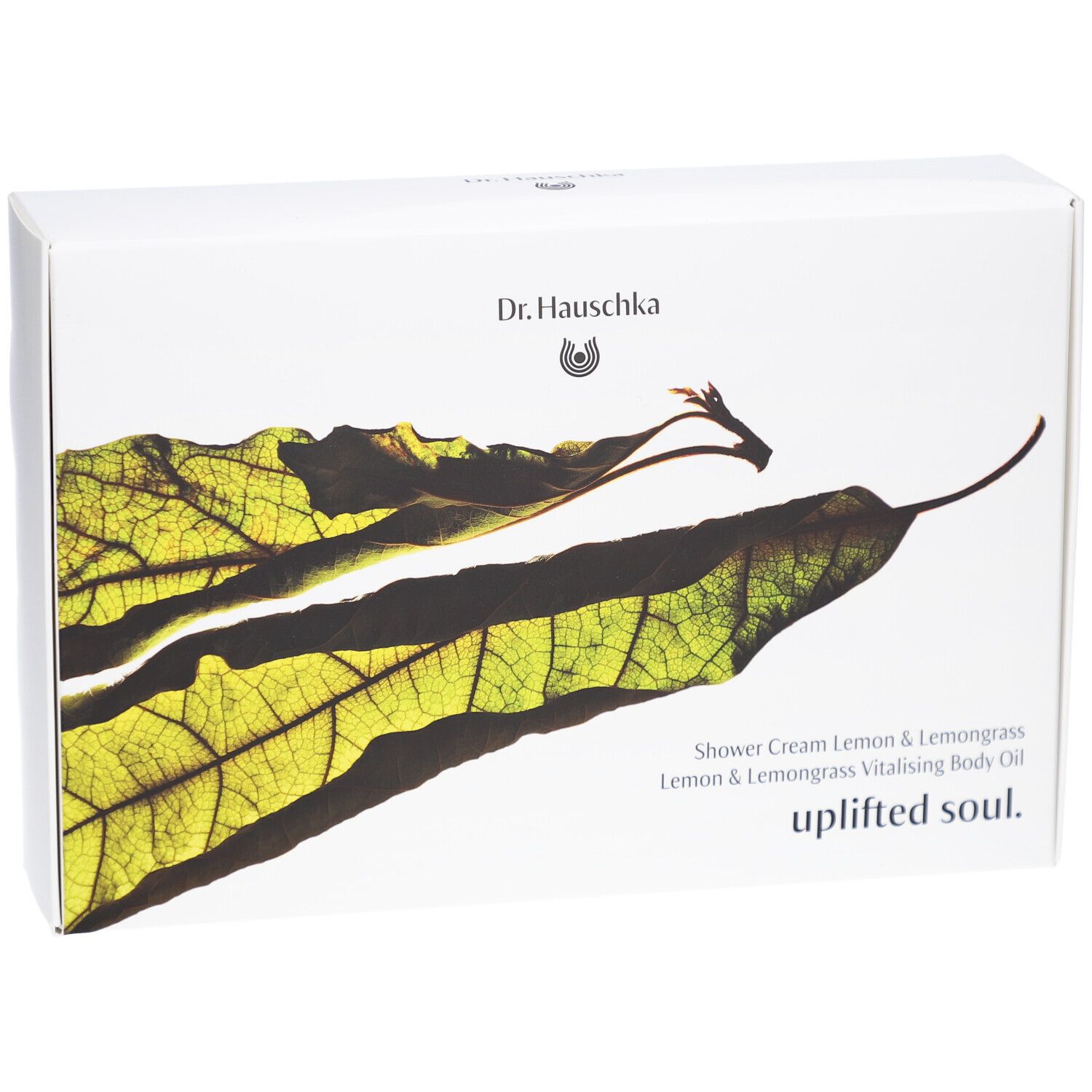 Boîte blanche avec motif de feuille et texte. Contient: Shower Cream Lemon & Lemongrass, Uplifted Soul.