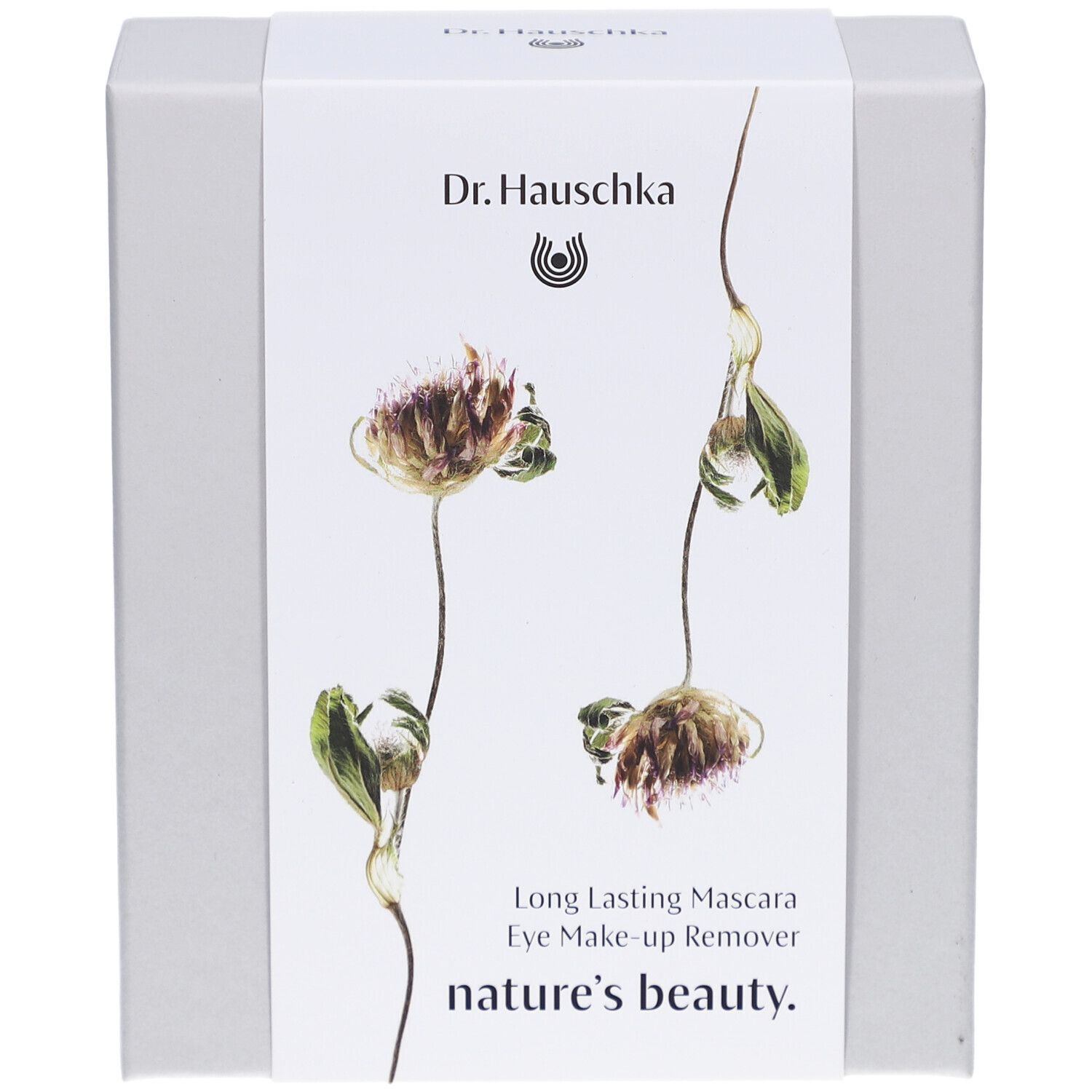 Boîte blanche avec motif floral et noms de produits. Inscription: Dr. Hauschka, Long Lasting Mascara, Eye Make-up Remover, nature's beauty.