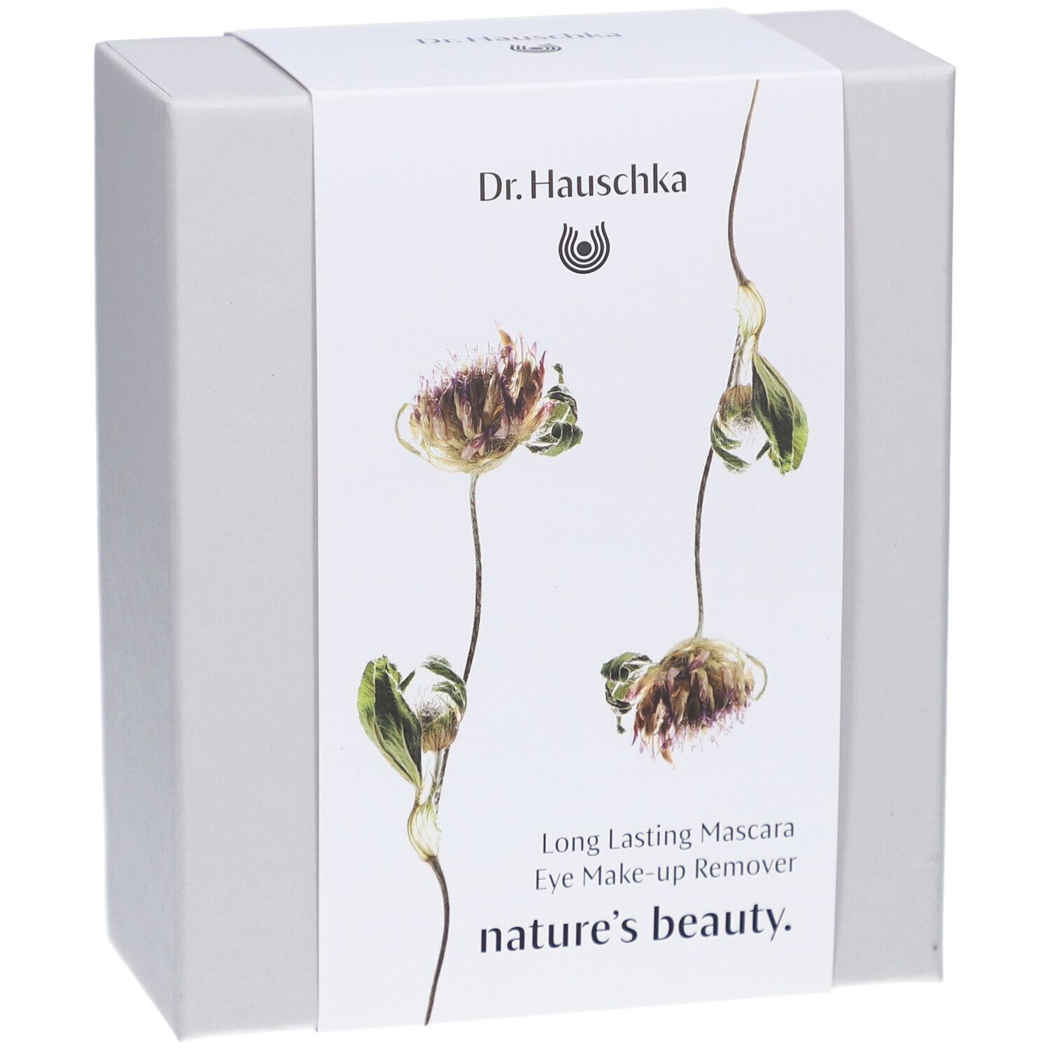 Boîte blanche avec motif floral et noms de produits. Inscription: Dr. Hauschka, Long Lasting Mascara, Eye Make-up Remover, nature's beauty.