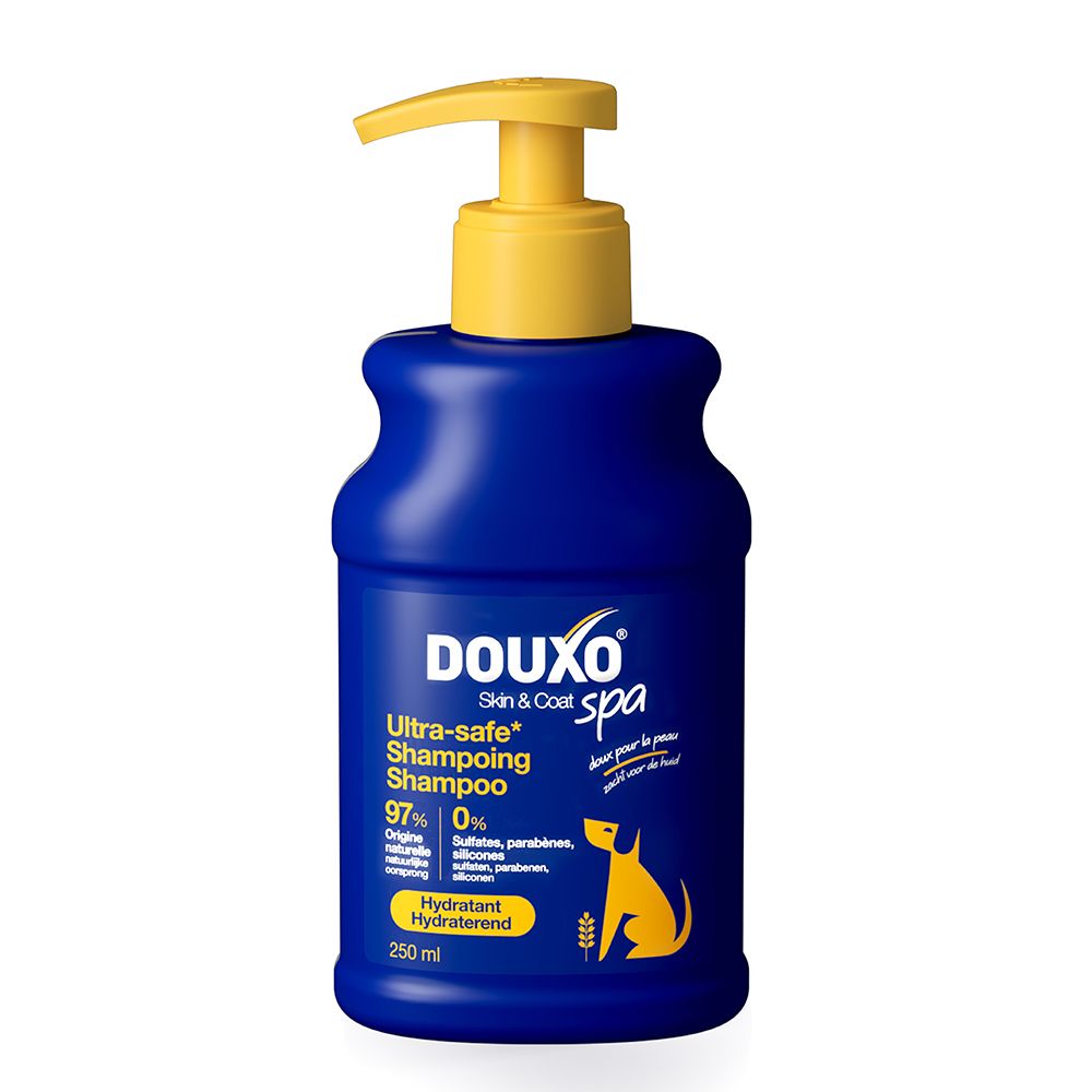 Flacon de shampooing bleu avec pompe jaune. Inscription: DOUXO Skin & Coat spa. 250 ml.