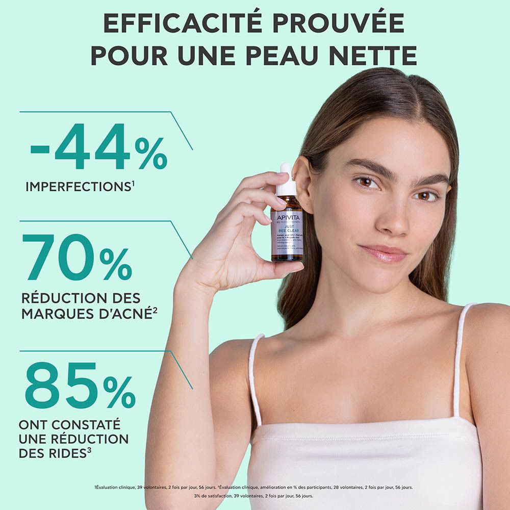 Femme tenant un flacon. Inscription : Apivita Just Bee Clear Sérum Anti-Imperfections. Texte sur les résultats.