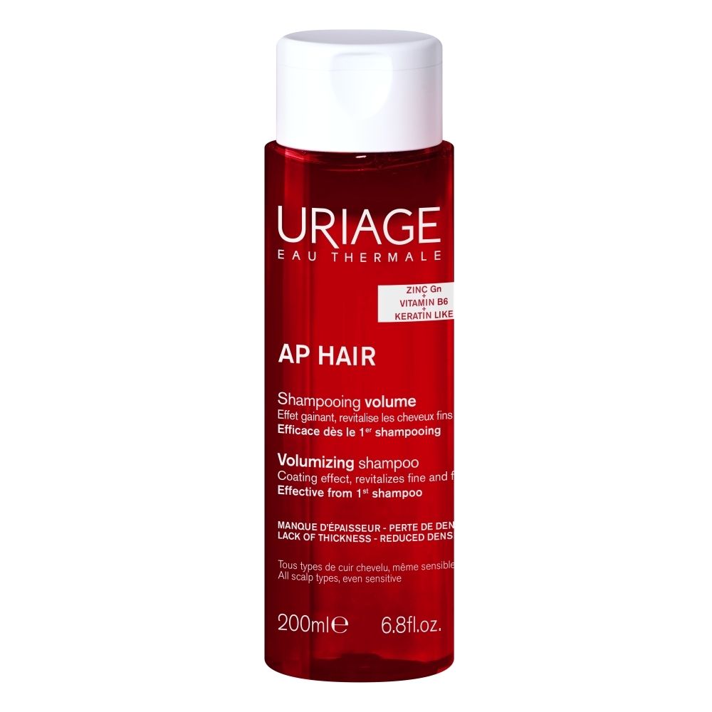 Flacon Uriage AP Hair Shampooing 200ml, liquide rouge, bouchon blanc.