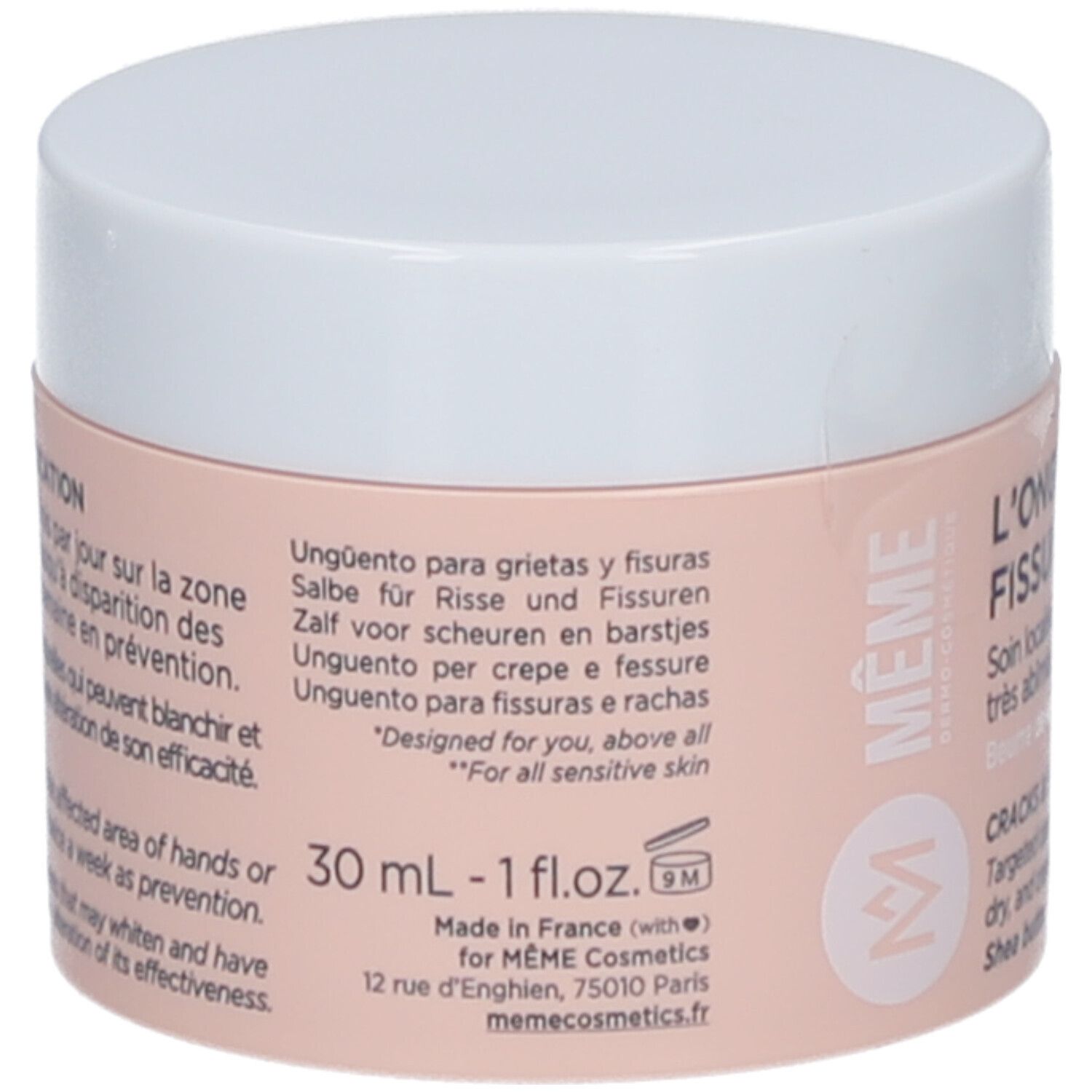 Pot de crème, couvercle blanc. Inscription: L'ONGUENT FISSURES & CREVASSES. Texte multilingue au dos. 30 ml.