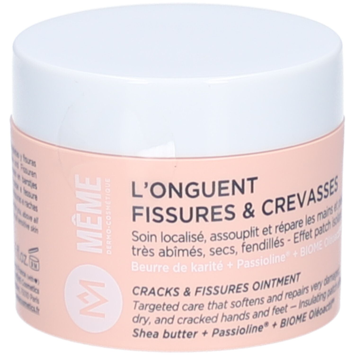 Pot de crème, couvercle blanc. Inscription: L'ONGUENT FISSURES & CREVASSES. Marque: MÊME. Étiquette rose avec informations.