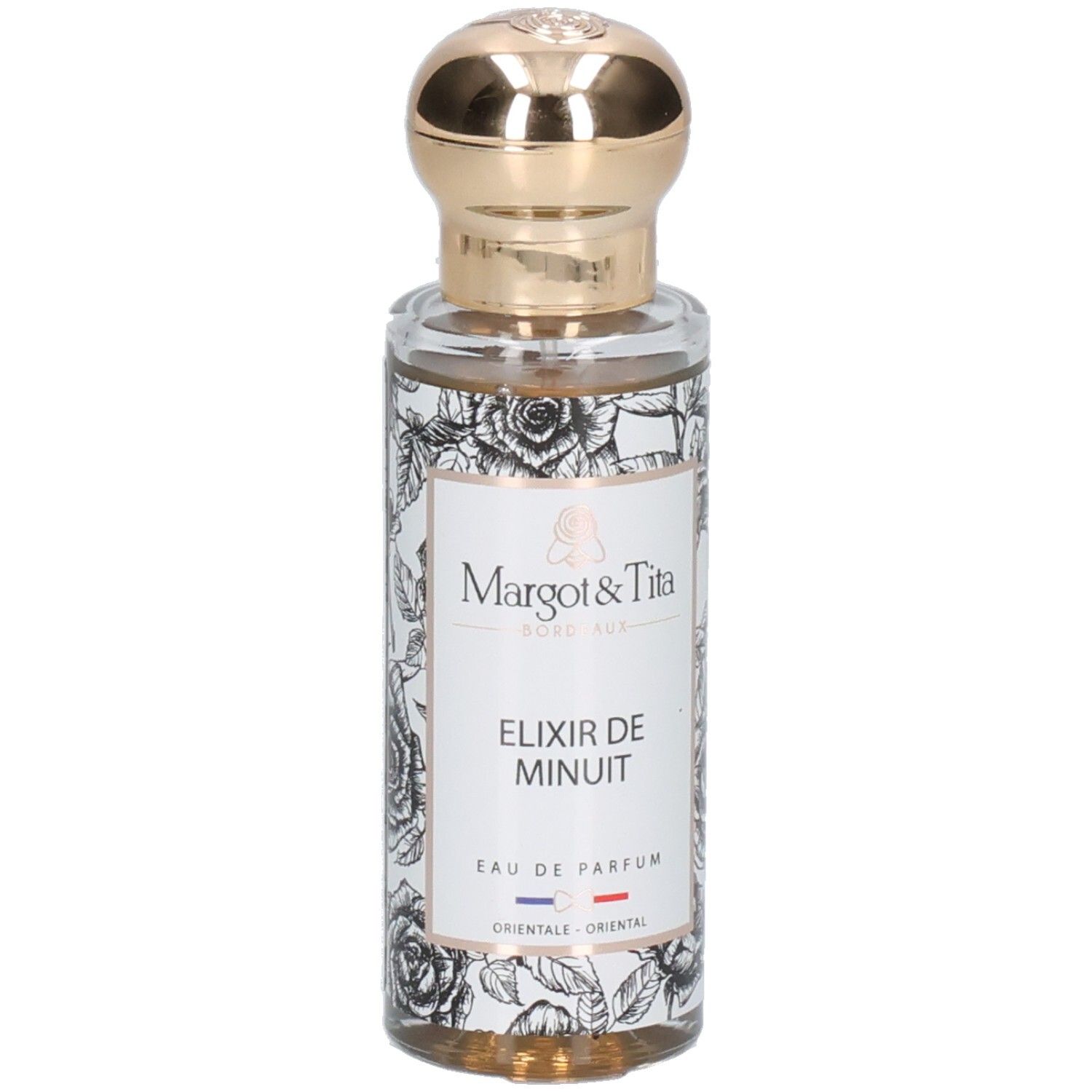 Margot & Tita Elixir de Minuit Eau de Parfum dans un flacon en verre avec bouchon doré et motif floral.