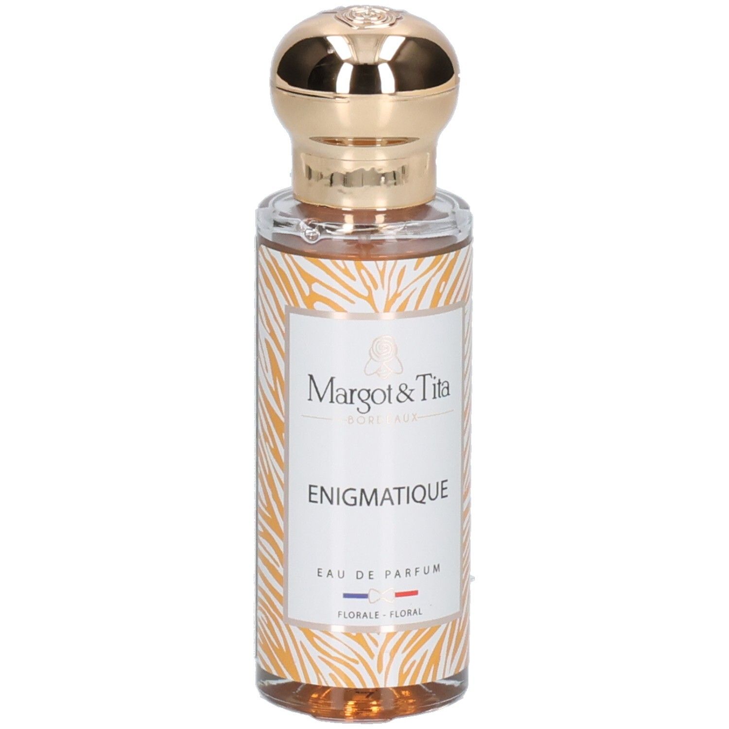 Margot & Tita Énigmatique Eau de Parfum dans un flacon en verre avec bouchon doré et motif animalier.