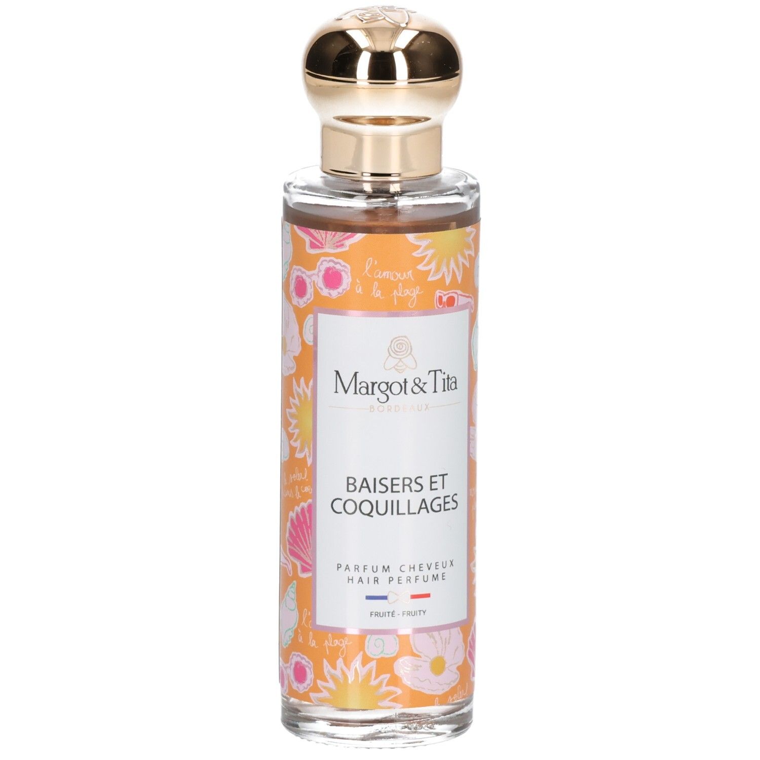 Parfum pour cheveux en flacon de verre avec bouchon doré. Étiquettes oranges décorées de coquillages et fleurs.