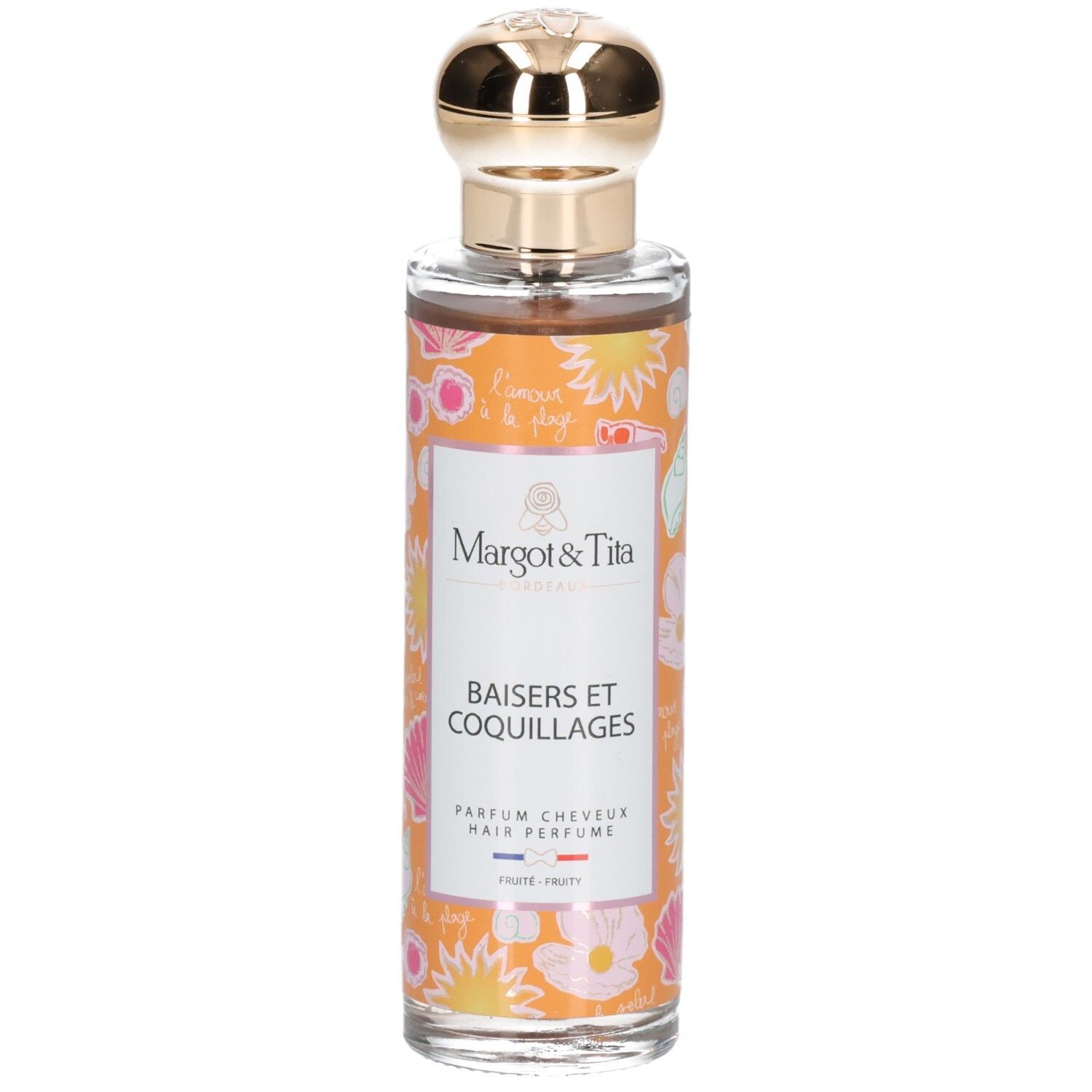 Parfum pour cheveux en flacon de verre avec bouchon doré. Étiquettes oranges décorées de coquillages et fleurs.