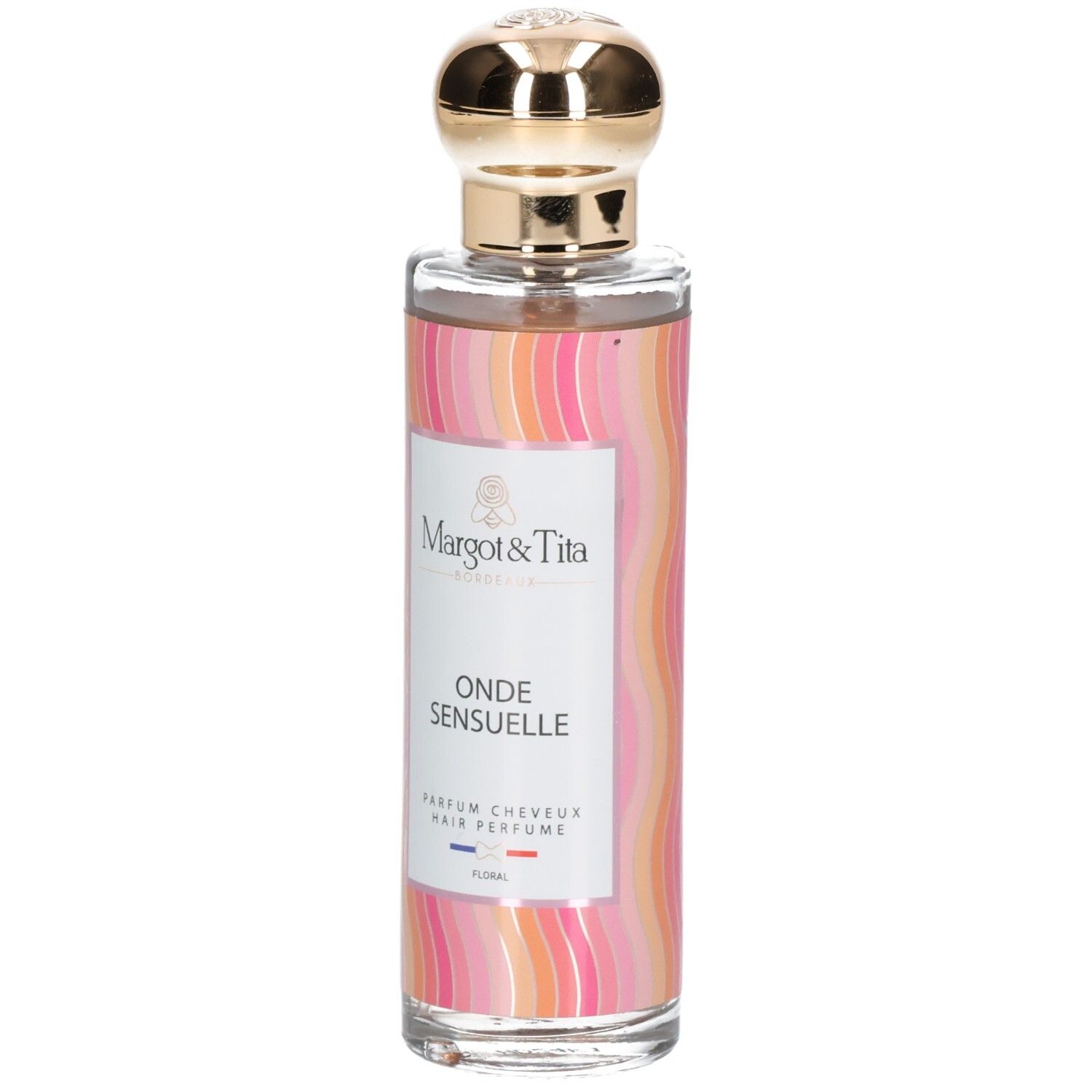 Flacon de parfum avec bouchon doré. Inscription: Onde Sensuelle, Parfum Cheveux. Marque: Margot & Tita.
