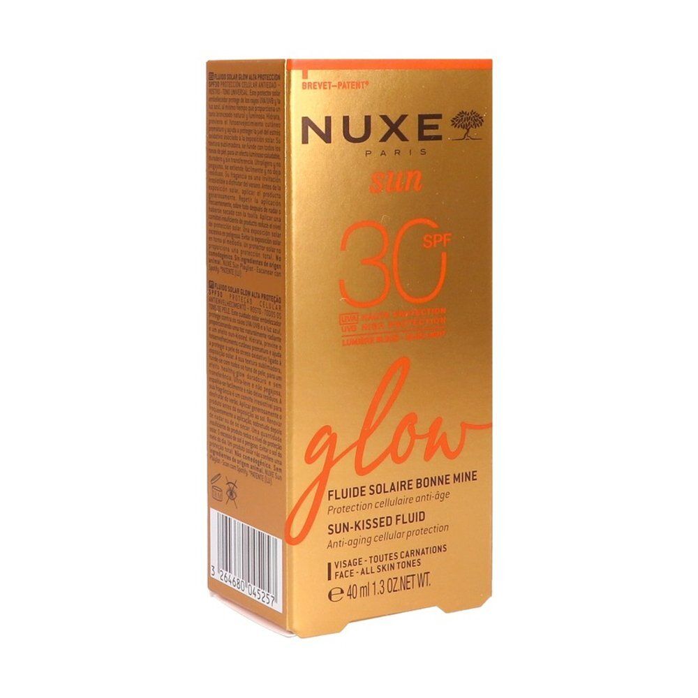 Côté de la boîte de fluide solaire Nuxe Sun SPF 30 avec symboles d'application et origine.