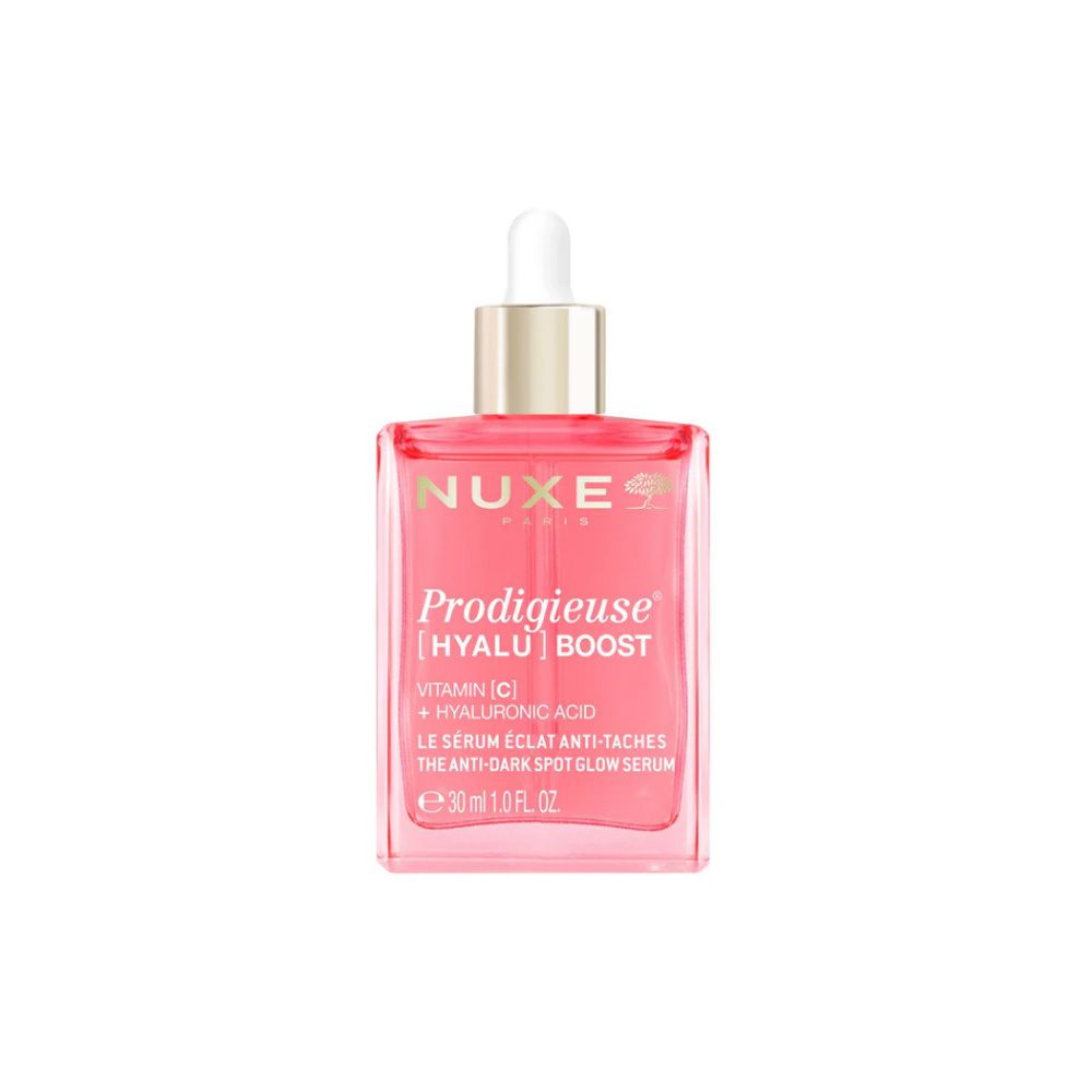 Flacon rose avec compte-gouttes blanc. Inscription: NUXE Prodigieuse [HYALU] Boost, Vitamine C + Acide hyaluronique.