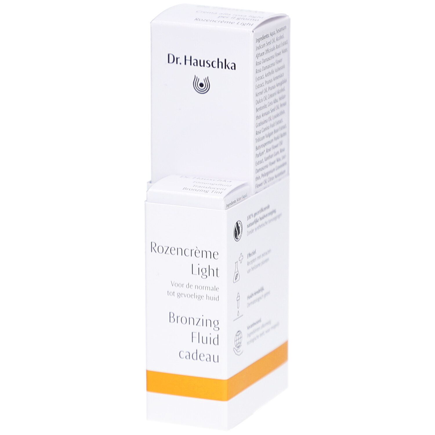 Emballage blanc avec informations produit. Inscription: Dr. Hauschka, Rozencrème Light, Bronzing Fluid cadeau.