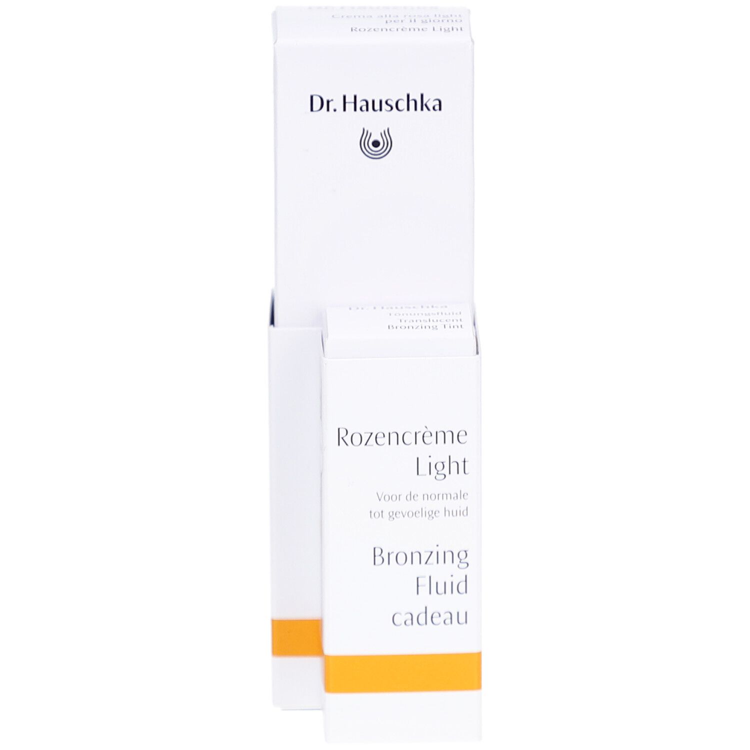 Emballage blanc avec produit. Inscription: Dr. Hauschka, Rozencrème Light, Bronzing Fluid cadeau.