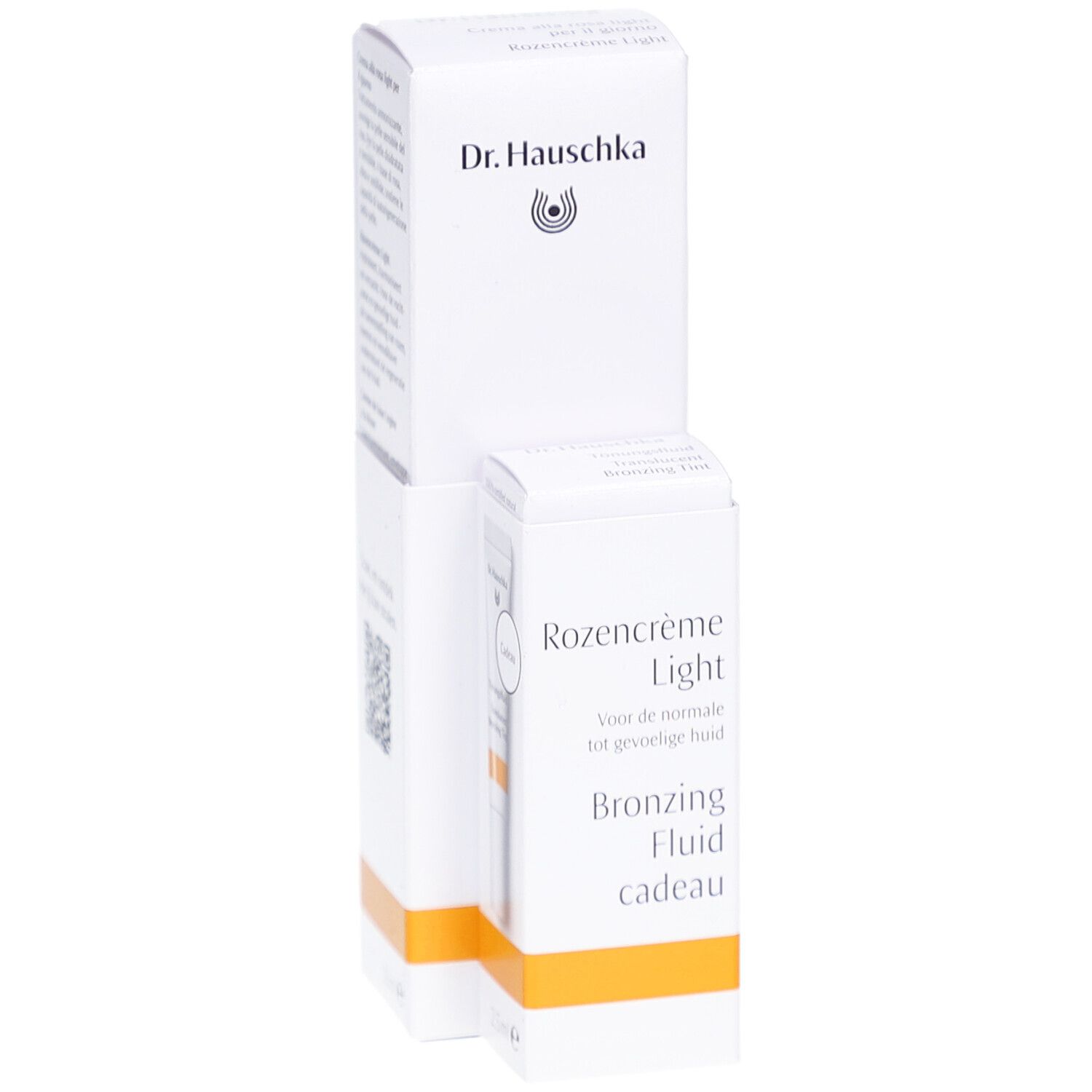 Emballage blanc avec produit. Inscription: Dr. Hauschka, Rozencrème Light, Bronzing Fluid cadeau.