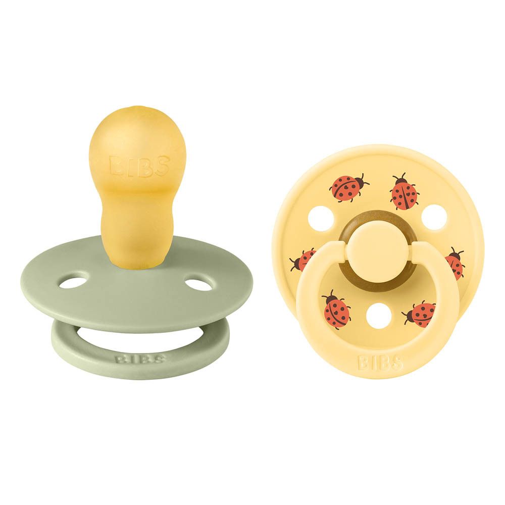 Deux sucettes BIBS. Vert et jaune, motifs coccinelles. Caoutchouc naturel.