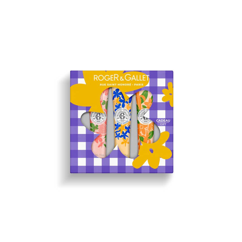 Coffret cadeau Roger&Gallet avec trois crèmes pour les mains. Tubes fleuris visibles. Inscription 'Cadeau'.