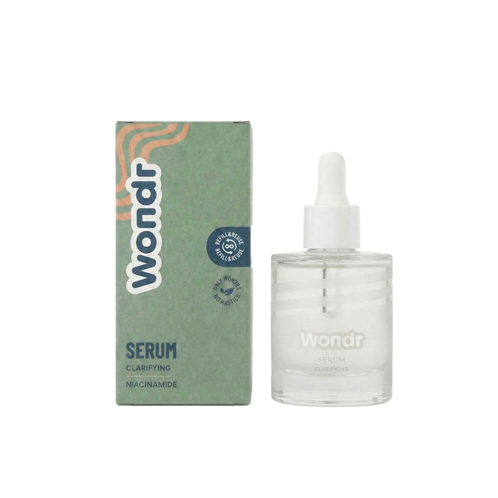 Sérum Clarifiant WONDR avec emballage. Flacon avec pipette et boîte. Emballage vert et orange.