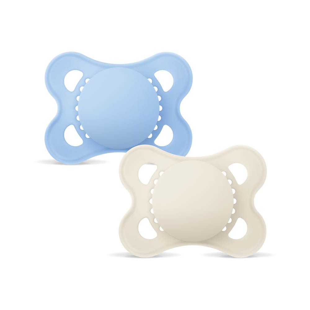 Deux sucettes MAM Original en silicone (0-6 mois) bleues et crème, détourées sur fond blanc.