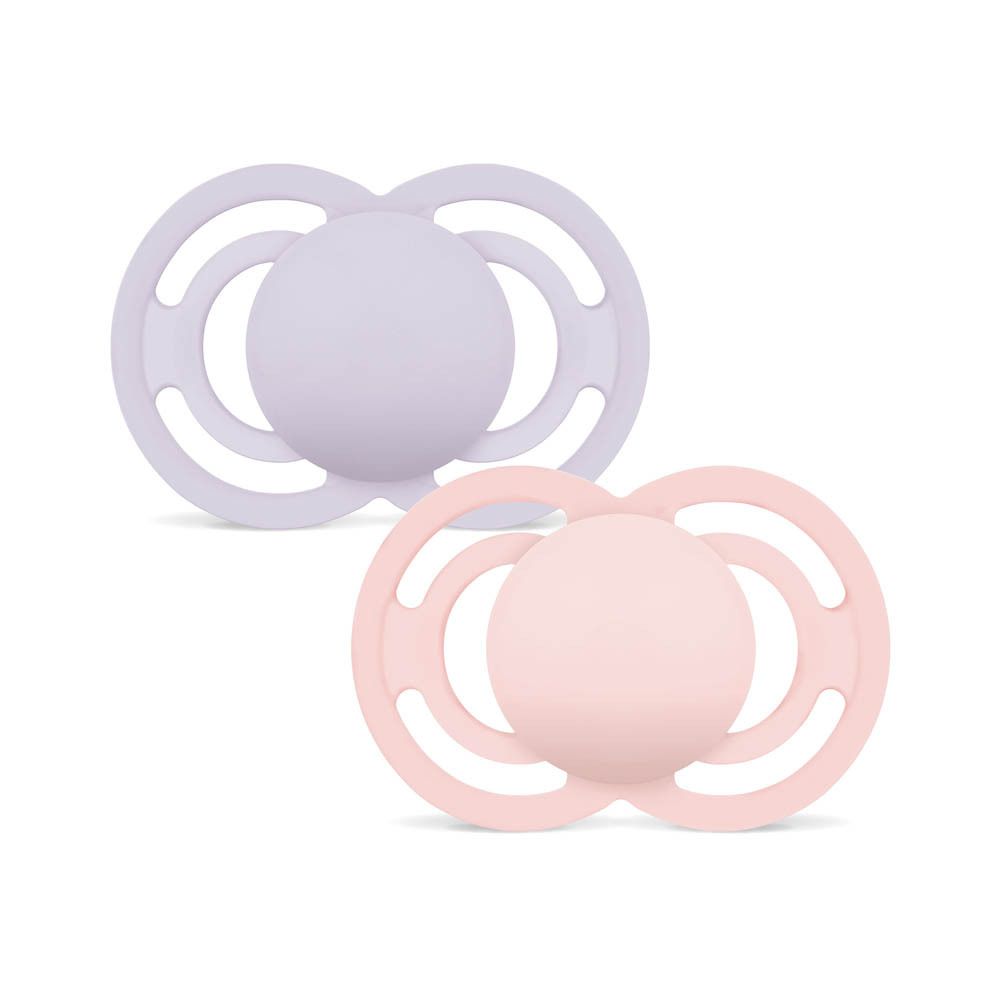 Deux sucettes MAM Perfect en silicone (6-16 mois) rose et lilas, dans leur étui de protection transparent.