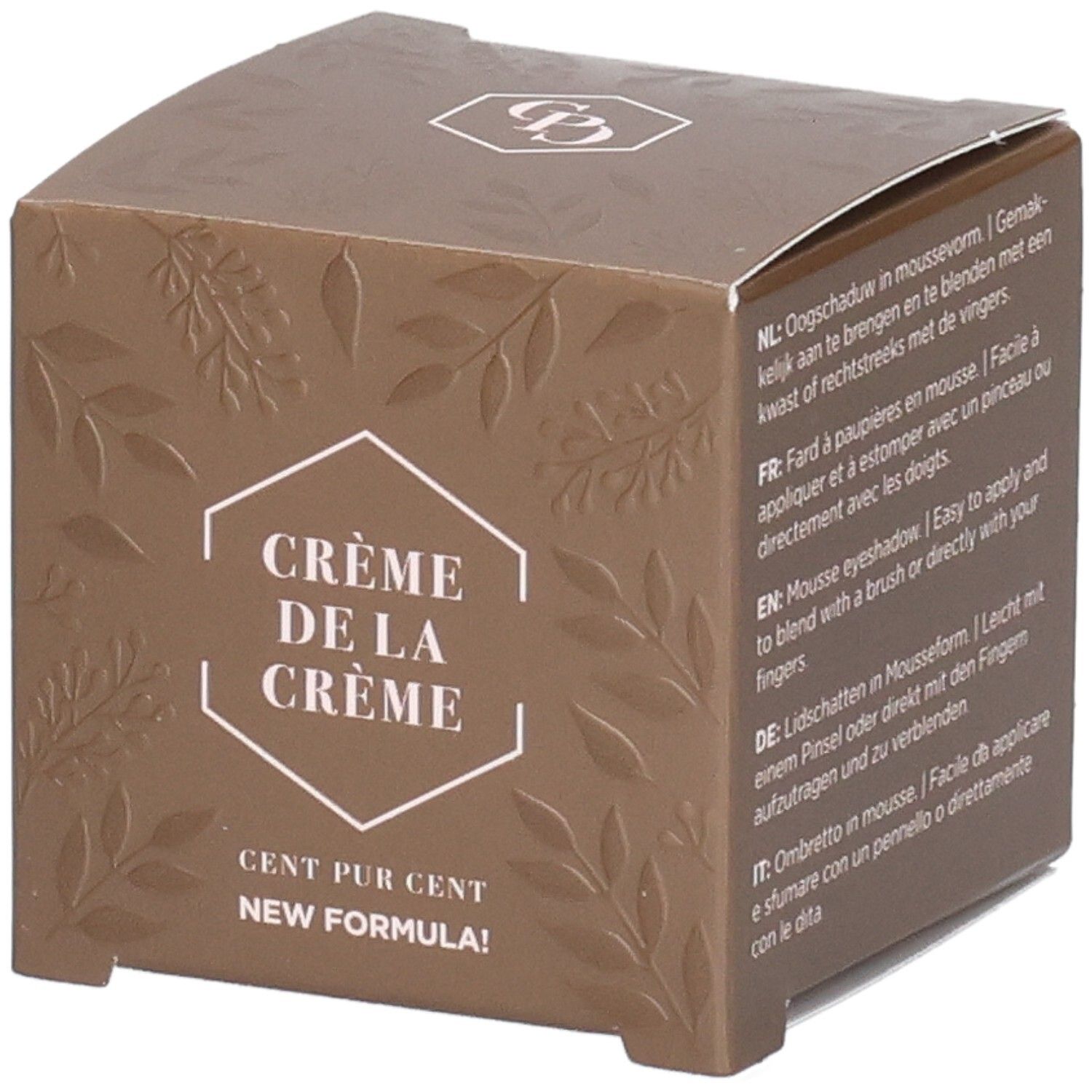 Boîte marron avec feuilles en relief. Texte : Crème de la Crème, Cent Pur Cent, New Formula. Logo en haut.
