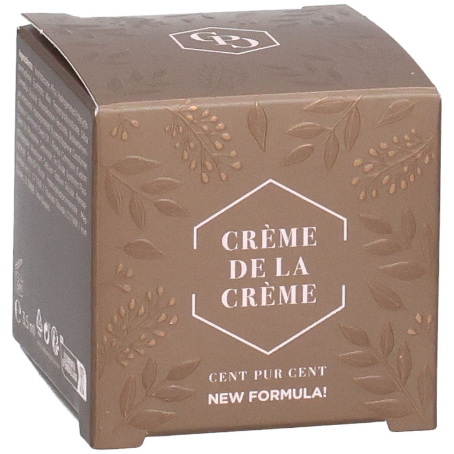 Boîte marron avec texte et feuilles en relief. Texte : Crème de la Crème, Cent Pur Cent, New Formula. Logo en haut.