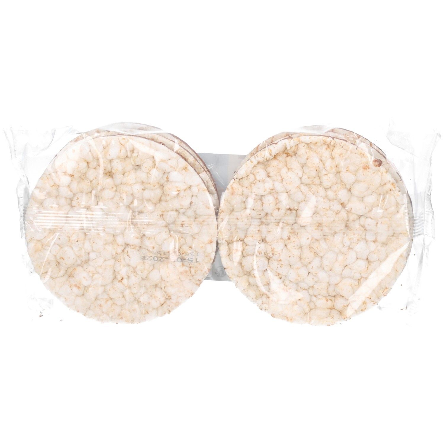 Emballage de galettes de riz. Galettes rondes et claires, emballées dans du film plastique. Plusieurs galettes visibles.