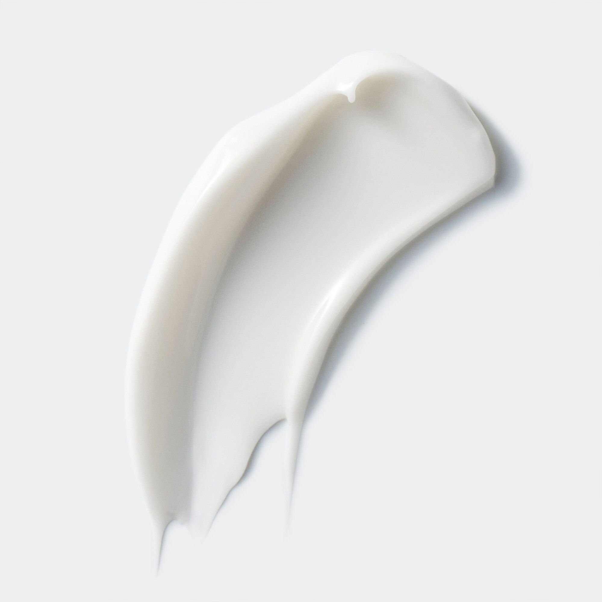 Échantillon de crème blanche. Texture visible.