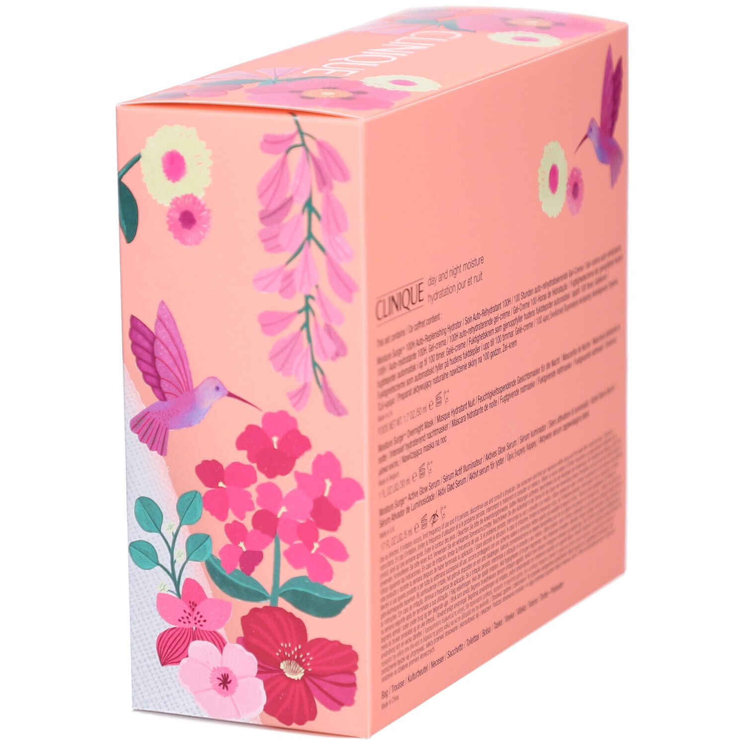 Coffret cadeau Clinique. Emballage rose avec fleurs et oiseau. Texte sur l'emballage.
