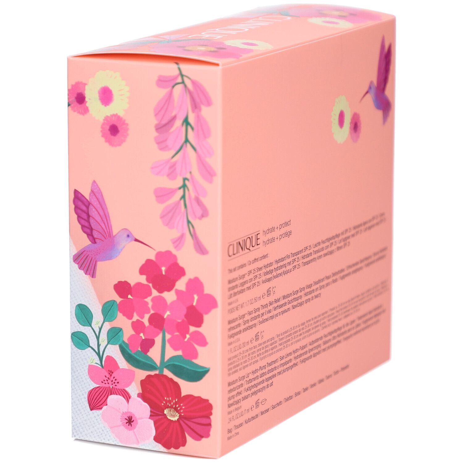 Vue latérale du coffret cadeau. Boîte rose avec informations sur le produit et motifs floraux. Texte en plusieurs langues.