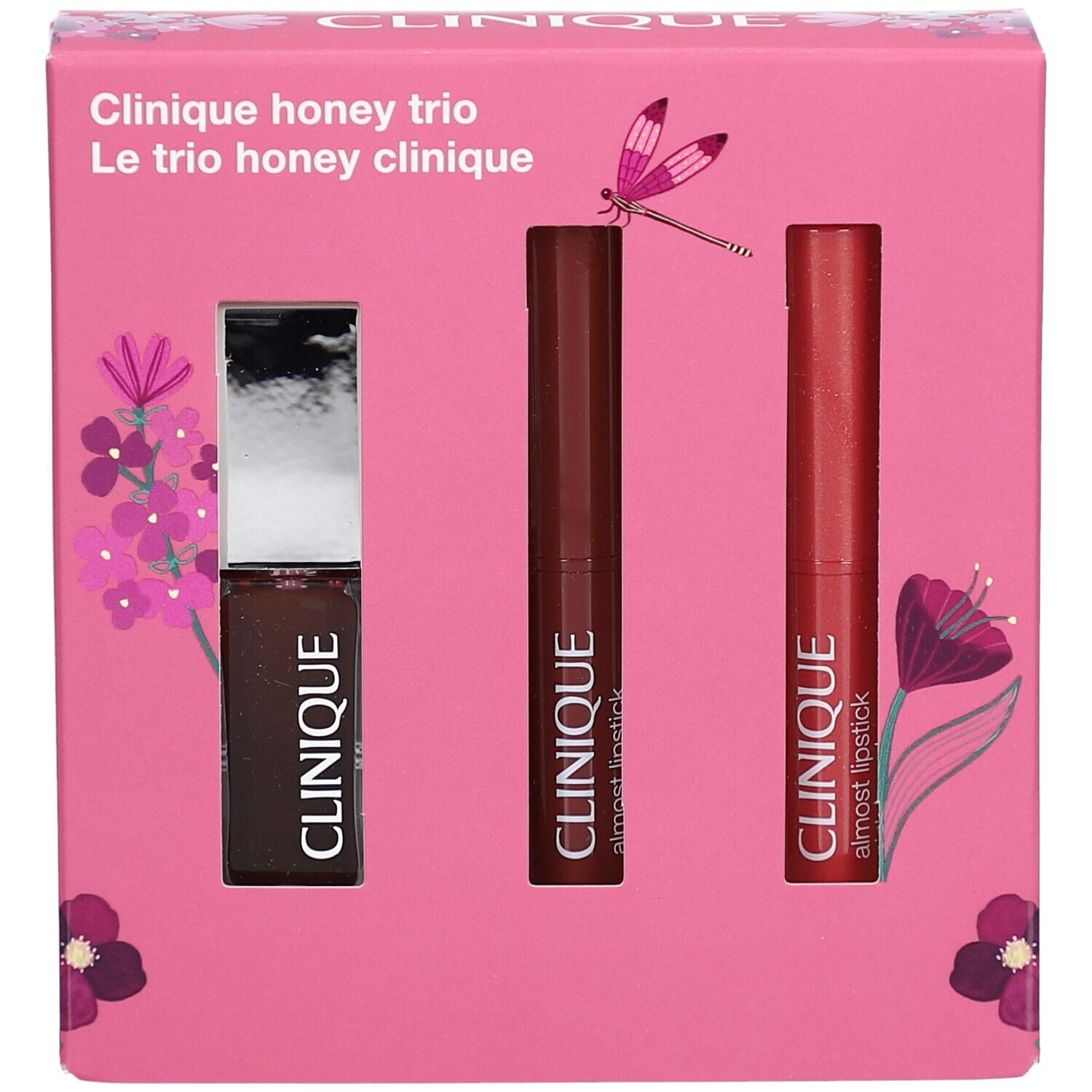 Coffret rose Clinique Honey Trio avec un gloss et deux rouges à lèvres. Inscription "Clinique honey trio" sur le devant du coffret.