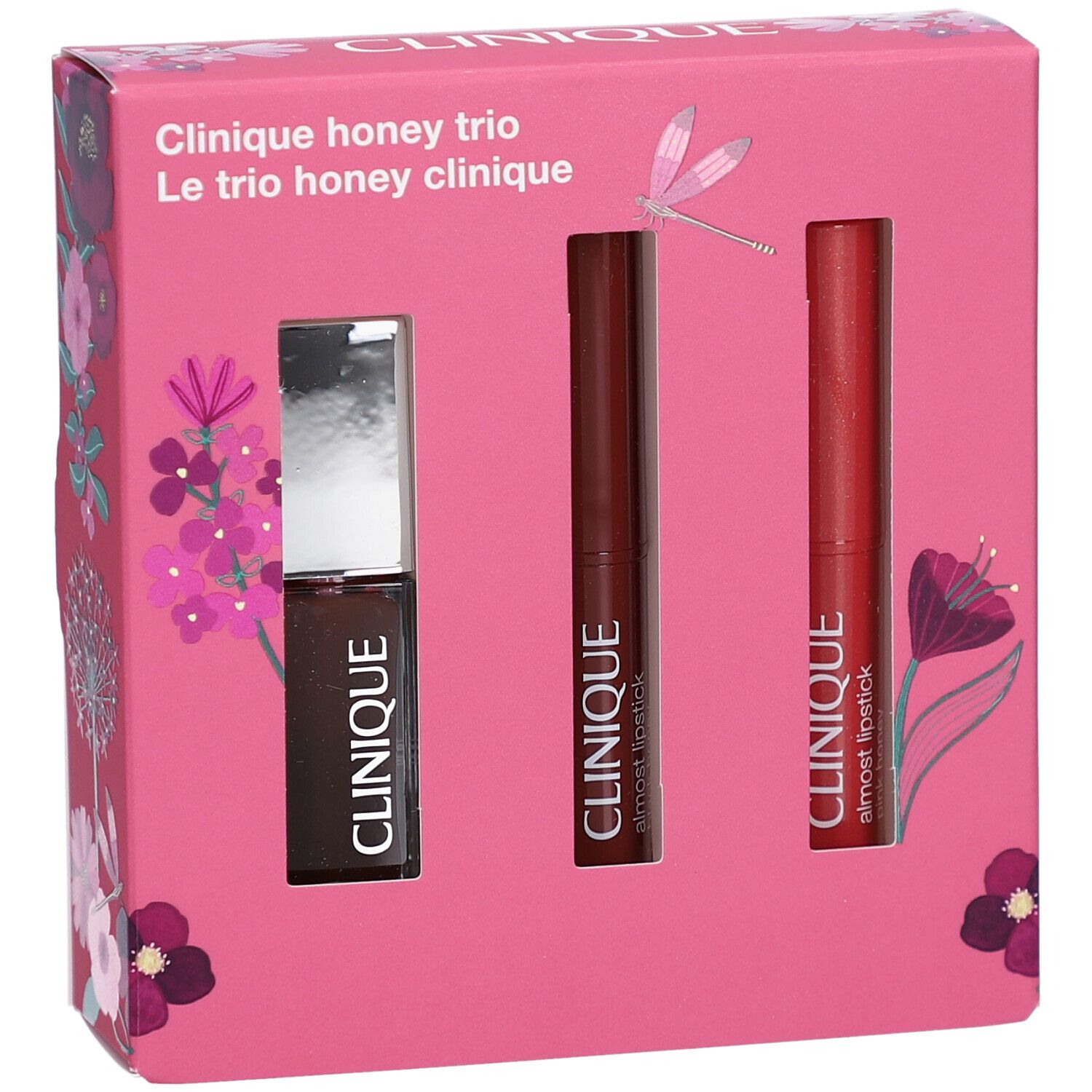 Coffret rose Clinique Honey Trio avec un gloss et deux rouges à lèvres. Inscription "Clinique honey trio" sur le devant du coffret.