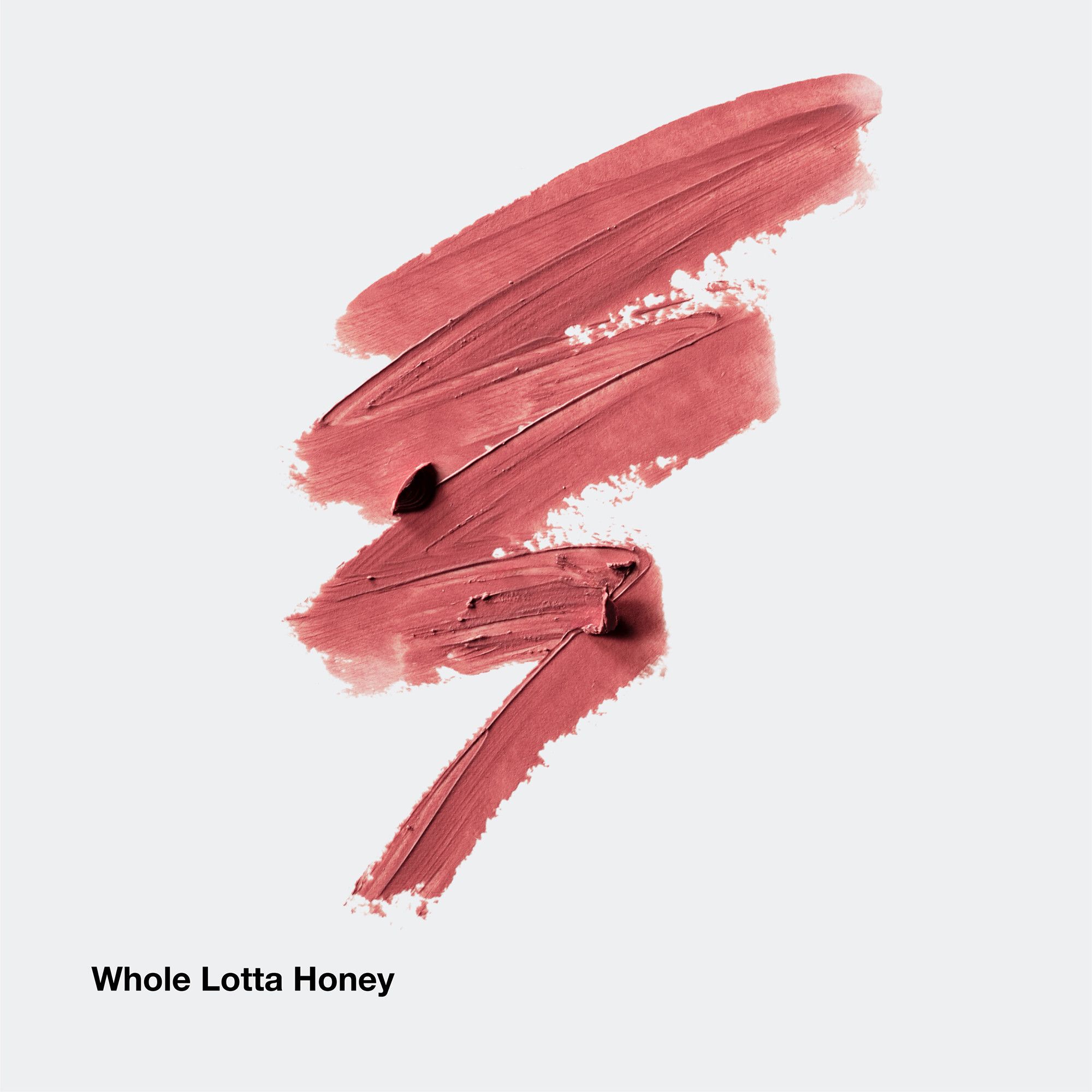 Échantillons de rouge à lèvres marron. Texte Whole Lotta Honey en bas.