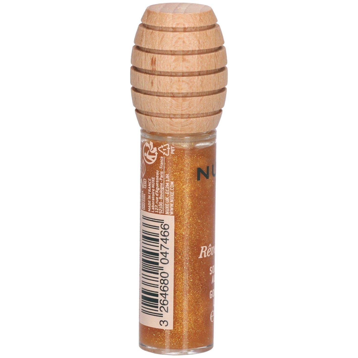 Gloss doré en flacon de verre avec bouchon en bois. Au dos, code-barres et texte. Nom du produit: Rêve de miel, Soin Lèvres au Miel Or.