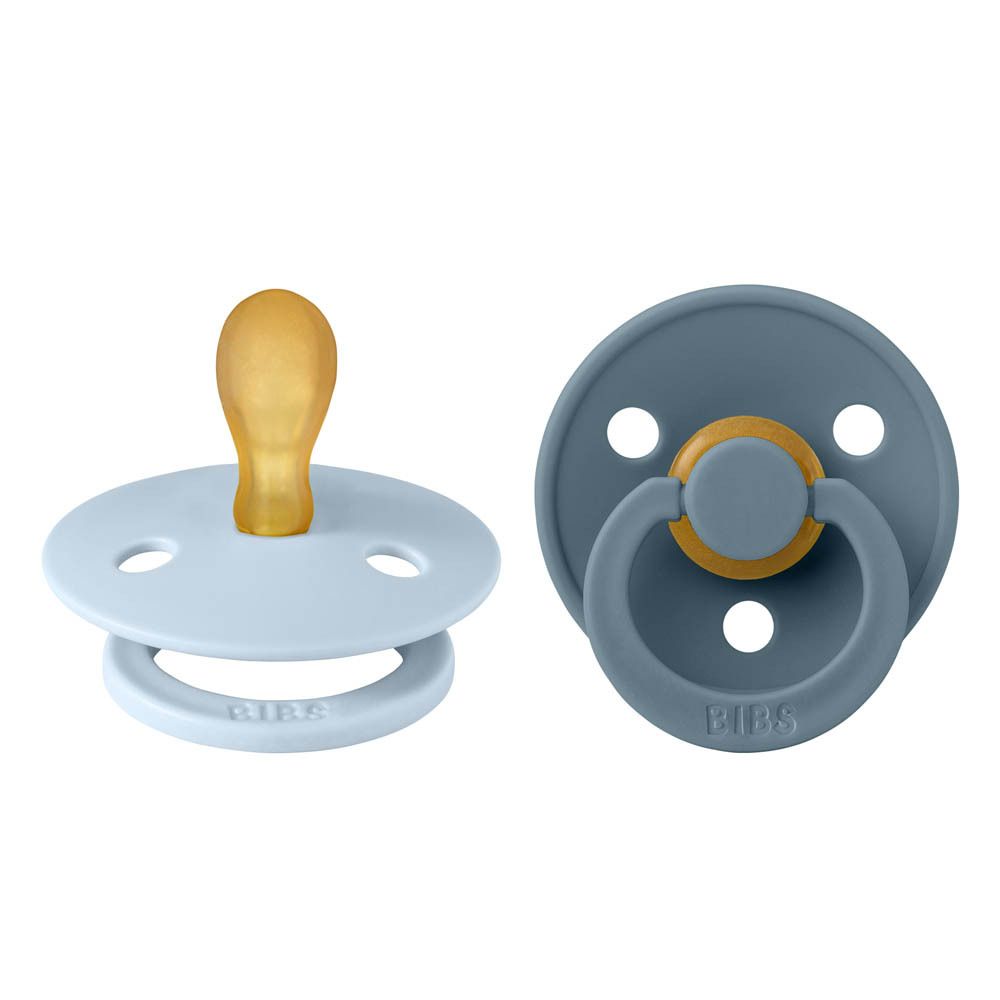 Deux sucettes bleues et pétrole. Marque BIBS. Forme ronde, tétine en silicone.
