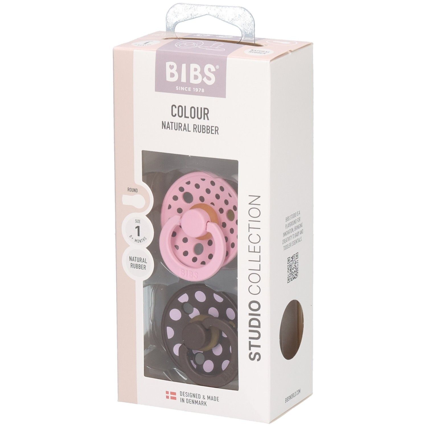 Emballage de deux sucettes. Rose et marron à pois blancs. Marque : BIBS. Fenêtre transparente.