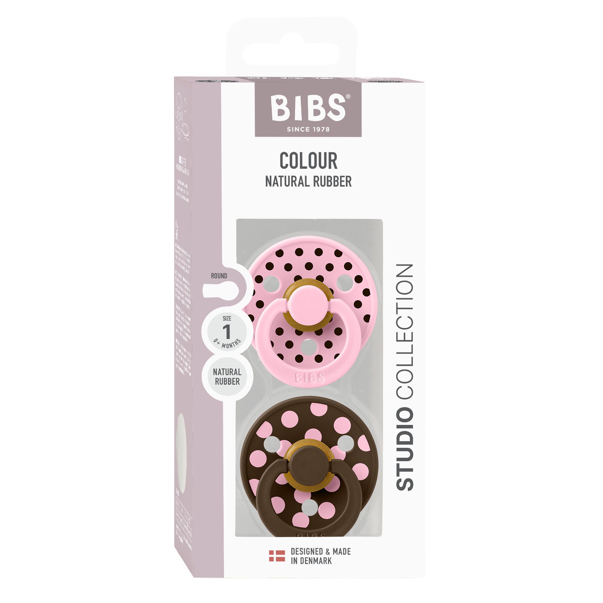 Emballage de deux sucettes. Rose et marron à pois blancs. Marque : BIBS. Fenêtre transparente.