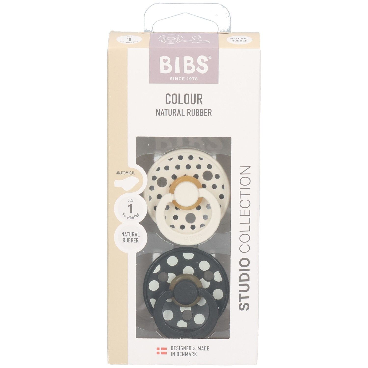 Boîte de deux sucettes BIBS. Motif à pois. Tétine anatomique. Caoutchouc naturel. Couleurs : noir et crème.