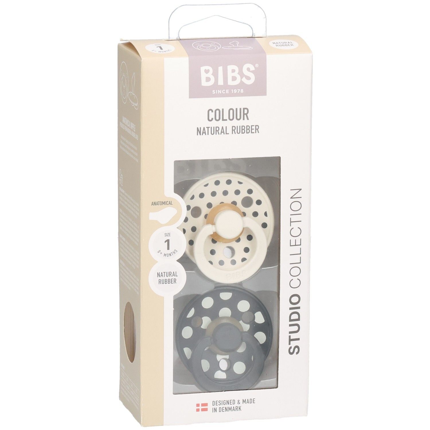 Boîte de deux sucettes BIBS. Motif à pois. Tétine anatomique. Caoutchouc naturel. Couleurs : noir et crème.